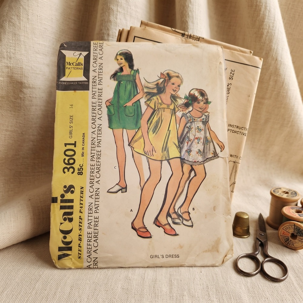 Vintage 1973 McCalls 3601 Girls Smock Dress Sewing Pattern Cape Sleeves Size 14‎